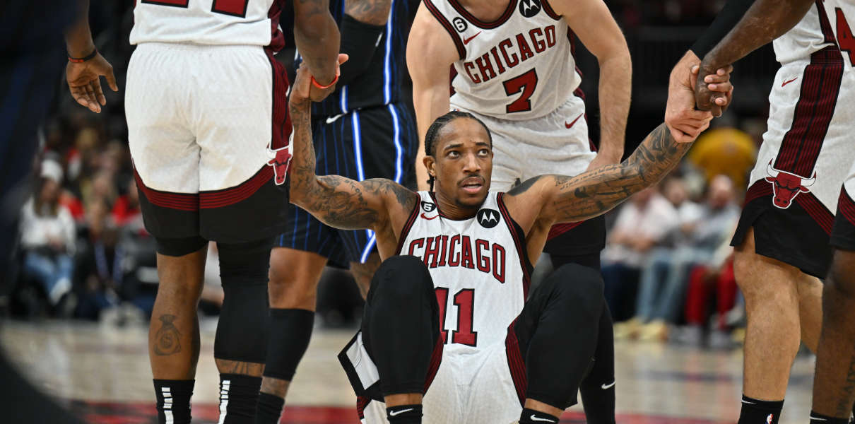 DeMar DeRozan is helped up by Chicago Bulls teammates