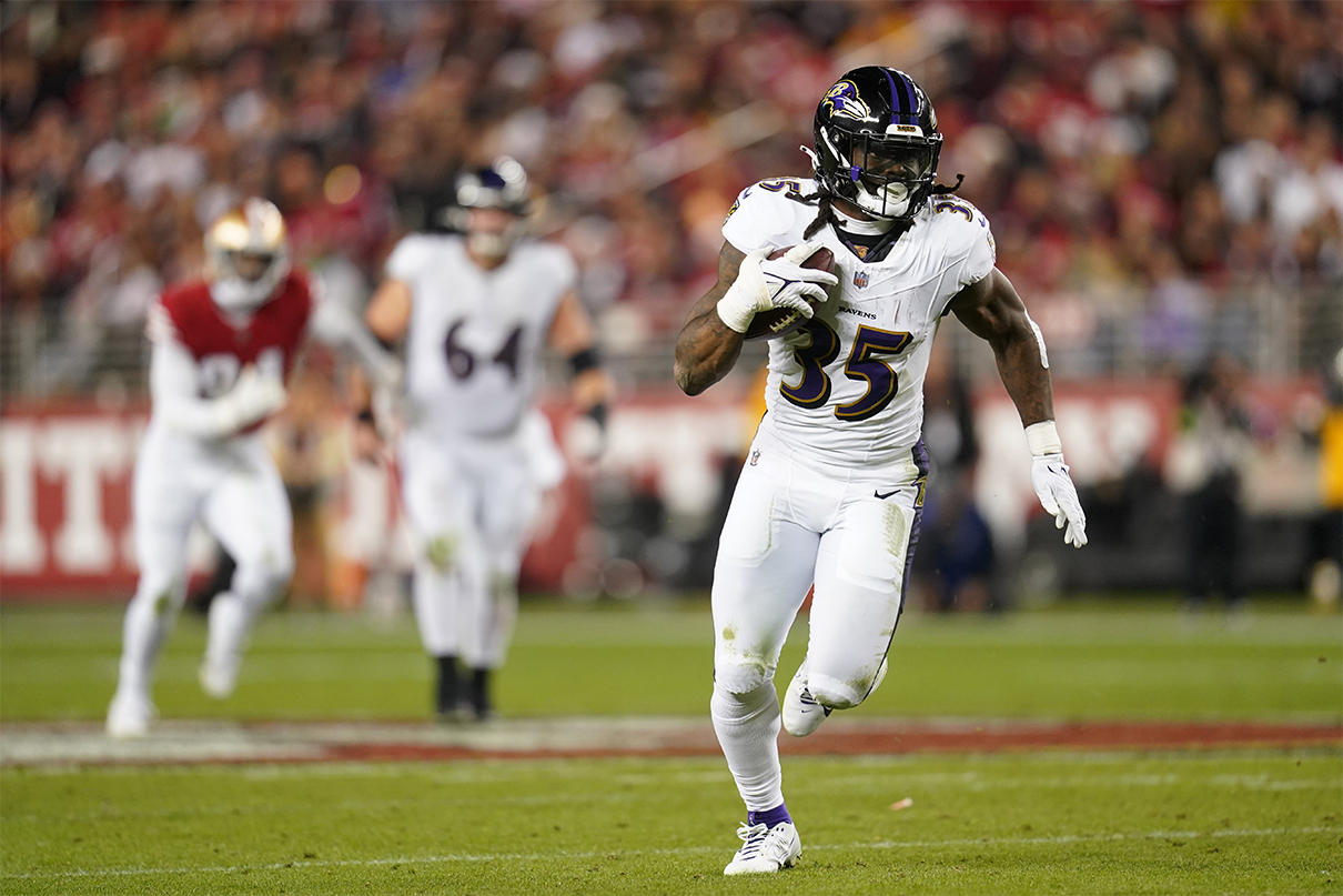 Dec 25, 2023; Santa Clara, California, USA; Baltimore Ravens running back Gus Edwards (35) runs the ball against the San Francisco 49ers in the third quarter at Levi's Stadium. Mandatory Credit: Cary Edmondson-USA TODAY Sports