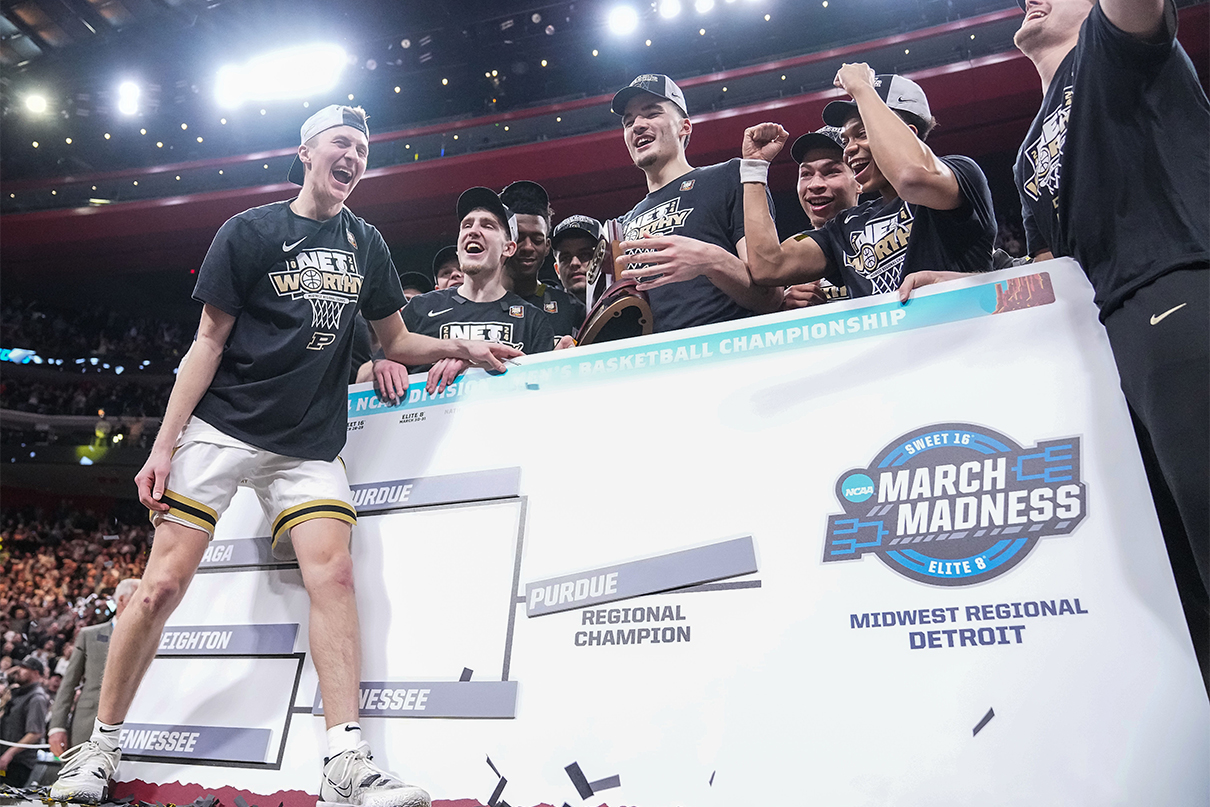 Purdue Boilermakers guard Fletcher Loyer (2) yells in excitement after moving Purdues name up the bracket Sunday, March 31, 2024, after winning the Midwest Regional championship game at Little Caesars Arena in Detroit. The Purdue Boilermakers defeated the Tennessee Volunteers to move on to the Final Four game in Phoenix, Arizona.