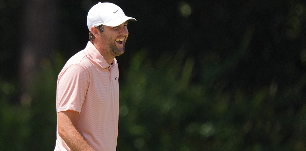 Jun 10, 2024; Pinehurst, North Carolina, USA; U.S. Open Odds favorite Scottie Scheffler shares a laugh on the second green during a practice round for the U.S. Open golf tournament at Pinehurst No. 2. Mandatory Credit: Katie Goodale-USA TODAY Sports