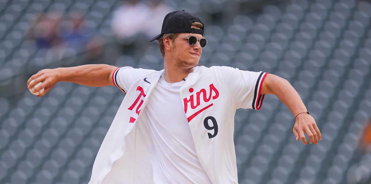 Jun 18, 2024; Minneapolis, Minnesota, USA; Minnesota Vikings first round draft pick JJ McCarthy throws out the ceremonial first pitch in a game between the Minnesota Twins and Tampa Bay Rays at Target Field. Mandatory Credit: Brad Rempel-USA TODAY Sports