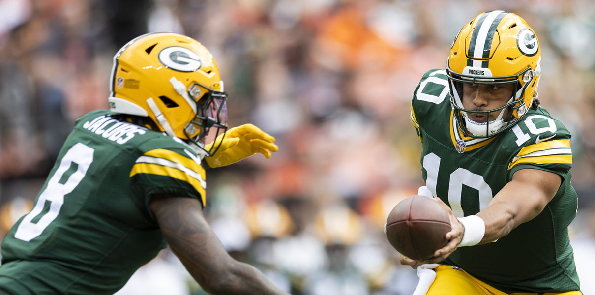 Aug 10, 2024; Cleveland, Ohio, USA; Green Bay Packers quarterback Jordan Love (10) hand the ball off to running back Josh Jacobs (8) during the first quarter against the Cleveland Browns at Cleveland Browns Stadium. Mandatory Credit: Scott Galvin-USA TODAY Sports