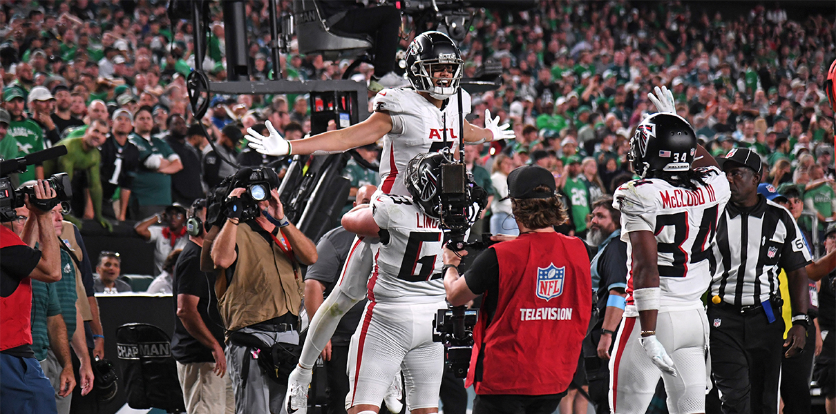 Sep 16, 2024; Philadelphia, Pennsylvania, USA;  Atlanta Falcons wide receiver Drake London (5) celebrates his game-tying touchdown with guard Chris Lindstrom (63) late in the fourth quarter against the Philadelphia Eagles at Lincoln Financial Field. Mandatory Credit: Eric Hartline-Imagn Images